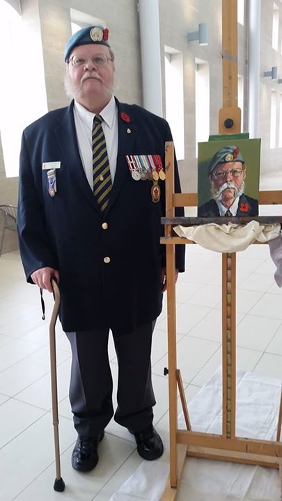 UN Veteran James Stoneburgh beside his portrait. #001/100 of 100 Portraits/100 Poppies project. Guelph City Hall. Monday July 6, 2015.