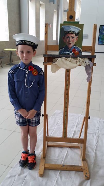 10 year old Sea Cadet Aurora Yorston standing beside her portrait. #002/100 in the 100 Portraits/100 Poppies project. Guelph City Hall. Monday July 6, 2015.