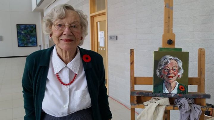 Image Caption: 95 year old veteran Sytske Drijber beside her portrait. #005/100 in the 100 Portraits/100 Poppies project. Guelph City Hall. Wed July 8, 2015.
