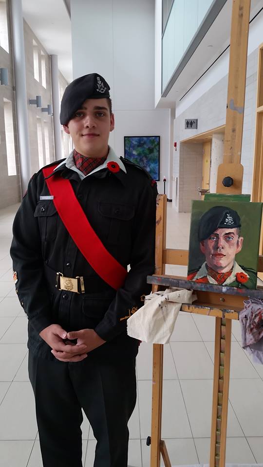 Darren Sargent, Warrant Officer with 1882 Wellington Rifles Army Cadets, stands beside his portrait. #006/100 of the 100 Portraits/100 Poppies project. Guelph City Hall. Wed July 8, 2015.
