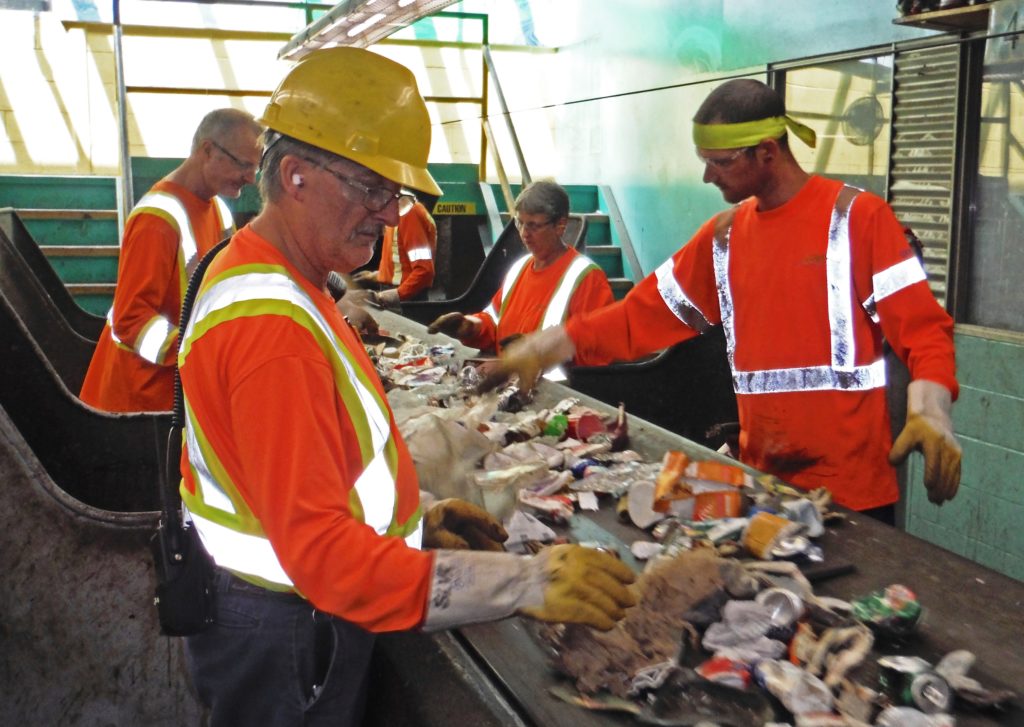 Guelph Solid Waste Resources staff working the line at the Material Recovery Facility