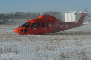 ORNGE helicopter ORNGE helicopter landing in a field