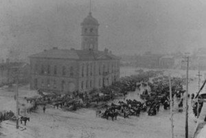 City Hall in the 1880's, with horse drawn vehicles parked outside