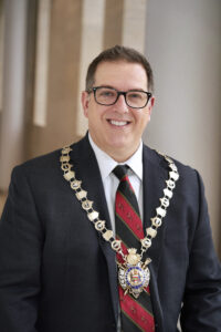 Mayor Cam Guthrie wearing the Chain of Office