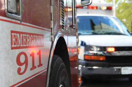 Emergency vehicles featuring an ambulance and a fire truck.
