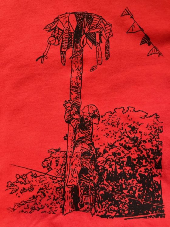 A photo of the drawing above silkscreened onto an orange t-shirt.