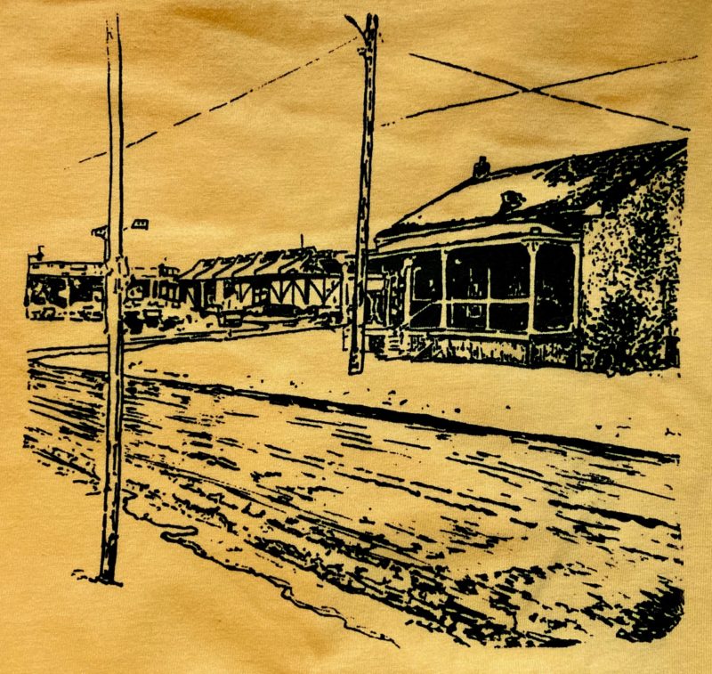 A photo of the drawing above silkscreened onto a yellow t-shirt.