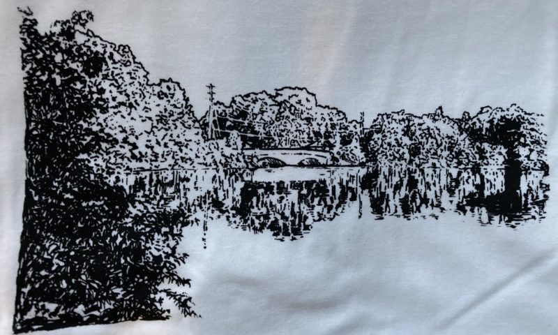 A photo of the drawing above silkscreened onto a white t-shirt.