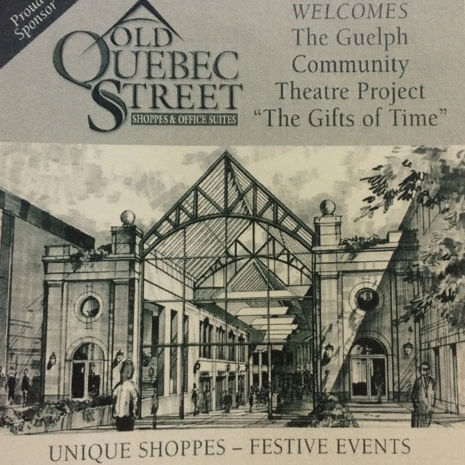A black and white newspaper clipping depicting a drawing of Old Quebec Street mall in Downtown Guelph. The advertisement lists Old Quebec Street Shoppes and Office Suites as a proud sponsor, welcoming The Guelph Community Theatre Project, “The Gifts of Time.”