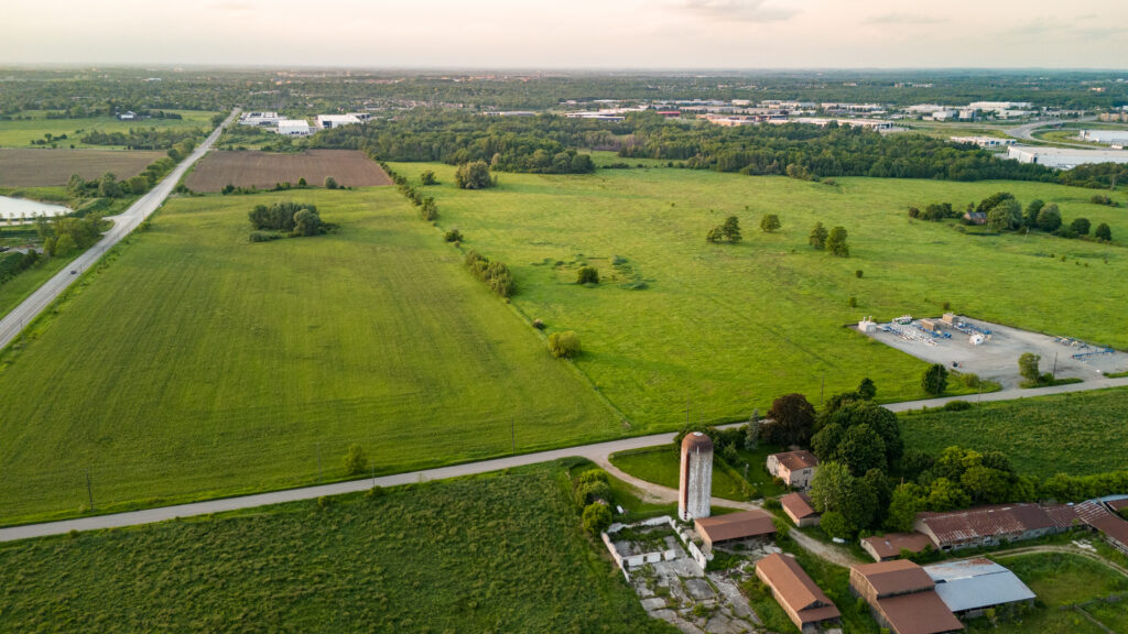 An aerial view of a green field