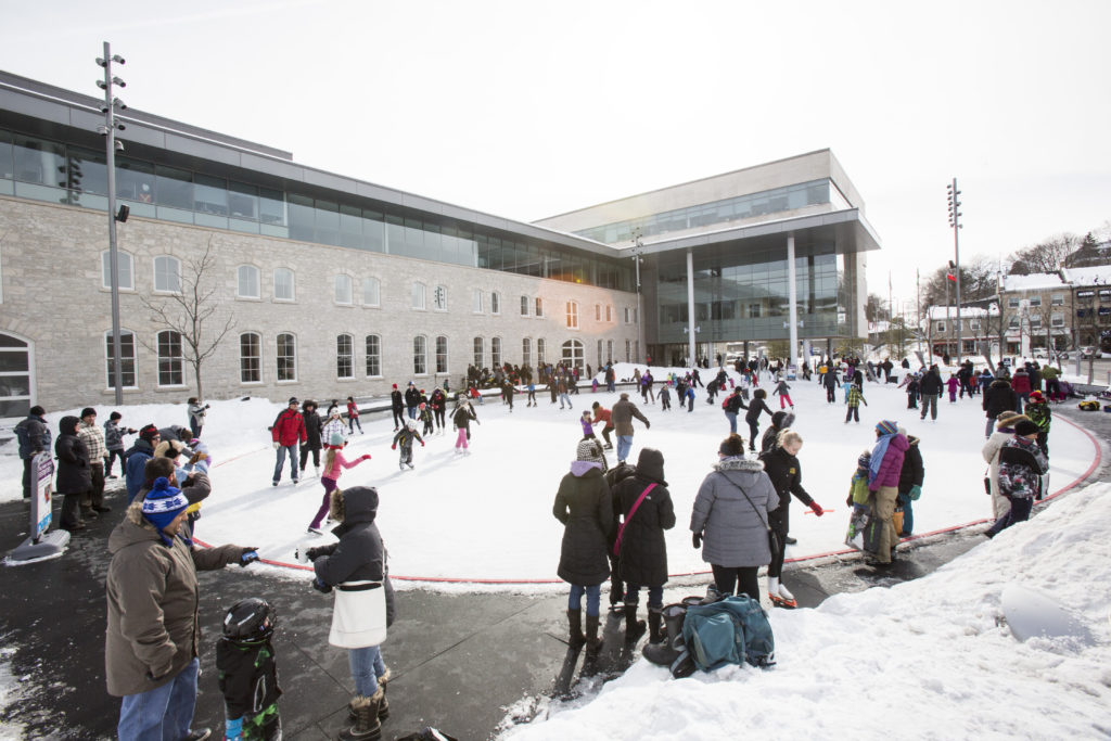 image is of the Market Square Ice Rink open and busy with skaters.