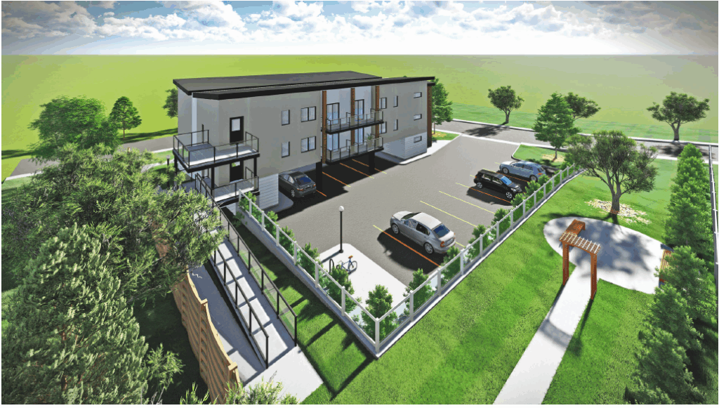 Overhead view from the rear of the property facing south, showing the parking area, including 13 spaces for the tenants. 